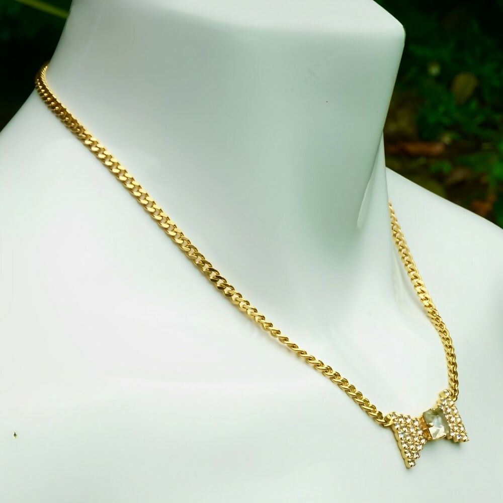 pierre-cardin-gold-plated-chain-necklace-with-clear-crystals-bow-pendant-3p