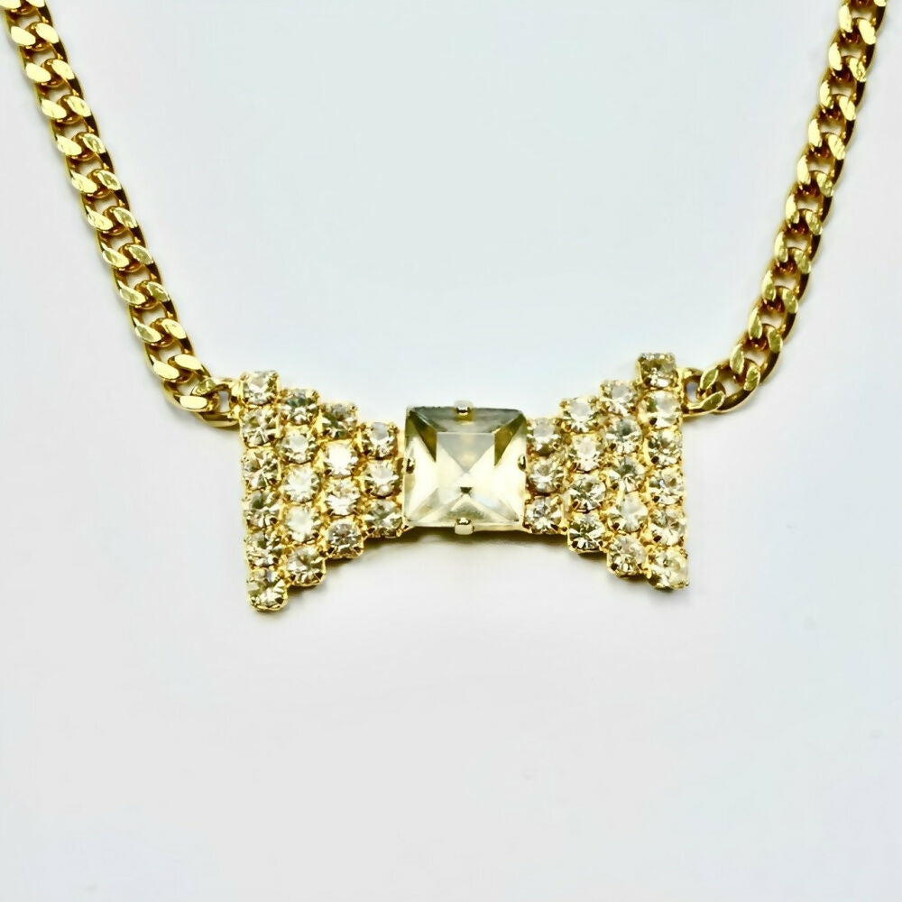 pierre-cardin-gold-plated-chain-necklace-with-clear-crystals-bow-pendant-5p