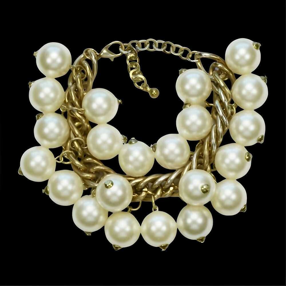 gold-plated-and-ivory-faux-pearl-cha-cha-bracelet-circa-1980s-4p