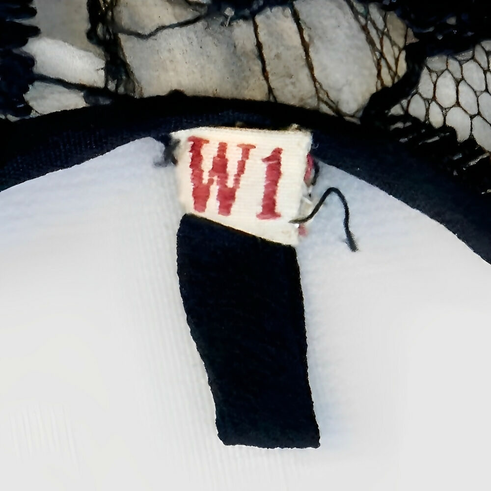 black-sleeveless-lace-dress-in-a-flower-design-with-front-ruffle-circa-1930s-7p